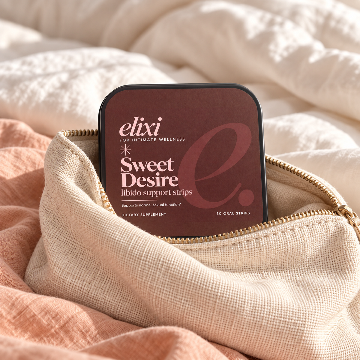 Sweet Desire tin with a cream linen pouch and soft peach fabric.